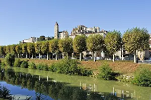 Gers Prints: View of historic buildings along a river in Auch