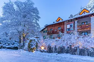 Chalet Prints: View of hotel and snow covered mountains in Courmayeur before dawn in winter