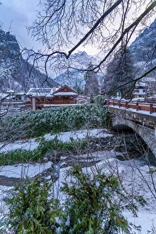 Lodges Prints: View of hotels and lodges with mountains in background during winter