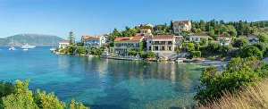 View of hotels overlooking Fiscardo harbour, Fiscardo, Kefalonia, Ionian Islands, Greek Islands, Greece, Europe