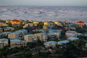 Overview Prints: View over the houses in Kubachi town with clouds below in Dagestan Russia