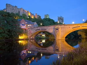 Durham Collection: View to the illuminated castle and cathedral across the River Wear below Framwellgate Bridge