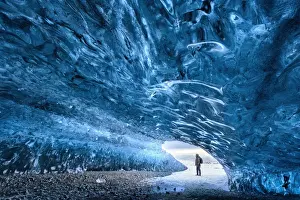 South Iceland Prints: View from inside ice cave under the Vatnajokull Glacier with person for scale, near