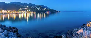 Vacationers Prints: View of Ionian Sea and Ipsos Beach in Ipsos at dusk