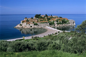 Sveti Stefan Prints: View of island and beach, Sveti Stefan, The Budva Riviera, Montenegro, Europe