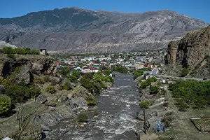 Geography Prints: View of the Karakoisu river flowing through a town in Dagestan, Russia on a sunny day