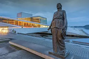 Cultural Landmark Prints: View of Kirsten Flagstad statue and Oslo Opera House reflecting in harbour on cloudy evening