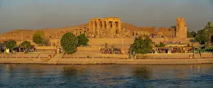 Nubia Prints: View of Kom Ombo Temple on the Nile river from cruise boat at sunset