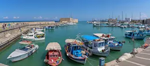 Docked Prints: View of Koules Venetian Fortress with boats at Heraklion Venetian Port in Crete during a sunny day in Greece
