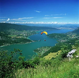 View over lake with paraglider, Lake Annecy, Rhone Alpes, France, Europe