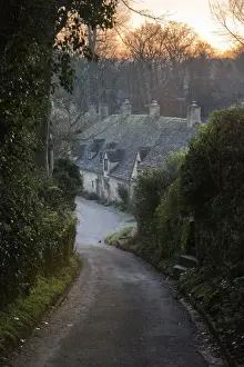 Cottages Prints: View down lane to Arlington Row Cotswold stone cottages at dawn, Bibury, Cotswolds