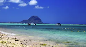 Mauritius Prints: View of Le Morne from Flic en Flac beach in Mauritius with boats and clear water on a sunny day