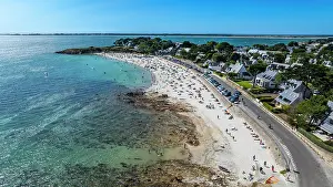 Swimming Prints: View of Legenese cove beach with sunbathers and clear water in Carnac