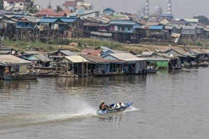 Traditionally Cambodian Prints: View of life along the Tonle Sap River headed towards Phnom Penh, Cambodia, Indochina