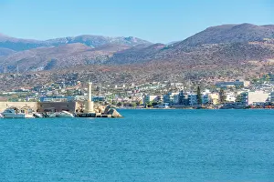 Hotels Prints: View of lighthouse and coastline with hotels in Limenas Chersonisou