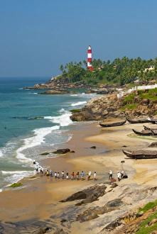 Fishing Net Prints: View to the Lighthouse with fishermen, Kovalam, Kerala, India, Asia