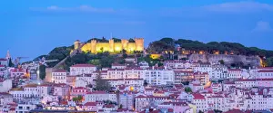 Miradouro Prints: View of Lisbon Castle from Miradouro de Sao Pedro de Alcantara at dusk