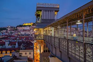 Touristic Prints: View of Lisbon Castle and Santa Justa Lift from Carmo Archaeological Museum during golden hour