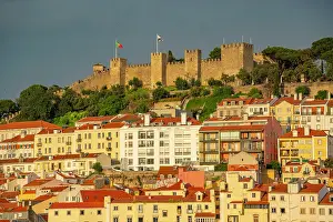 Flags Prints: View of Lisbon Castle from Santa Justa Lift during golden hour, Lisbon, Portugal, Europe