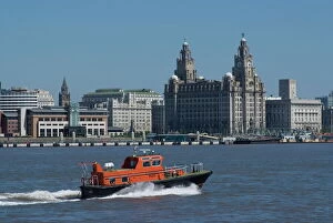 Images Dated 24th June 2009: View of the Liverpool skyline and the Liver building, with a pilot boat in the foreground