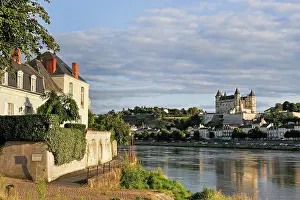 Loire Prints: View of the Loire River bank with Chateau de Saumur in the background during daylight in Maine-et-Loire region