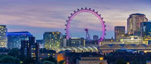 Ferris Wheel Collection: View of the London Eye and rooftop of Waterloo Station at dusk, Waterloo, London, England