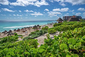 View of long white sandy beach at Playa Delfines, Hotel Zone, Cancun, Caribbean Coast, Yucatan Peninsula, Mexico, North America