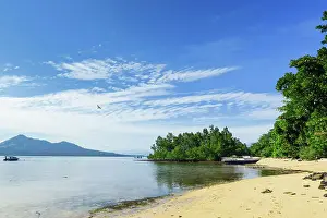 View to mainland and Gunung Tumpa at an eastern beach on this coral fringed holiday island, Bunaken, North Sulawesi, Indonesia, Southeast Asia, Asia