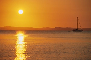 View to mainland from Monkey Beach at sunset, Great Keppel Island, Queensland, Australia