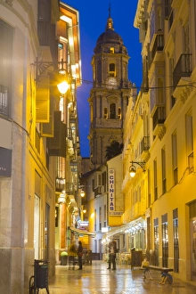 Costa Del Sol Prints: View of Malaga Cathedral from Calle Marques de Larios at dusk, Malaga, Costa del Sol