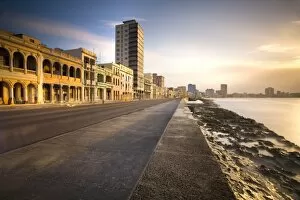 Foot Path Collection: View along The Malecon at dusk showing mix of old and new buildings, Havana