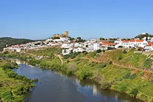 Alentejo Prints: View of Mertola from bridge over Guadiana River in Alentejo region of Portugal during a clear day