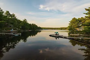 Kayaking Prints: View of Millet Lake during sunset with boats and reflections seen in the calm water in Chester Nova Scotia