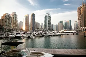Estate Prints: View of modern skyscrapers shining in sunrise light in Dubai Marina in Dubai
