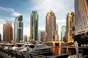 Innovation Prints: View of modern skyscrapers shining in sunrise lights in Dubai Marina in Dubai