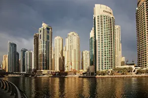 Cosmopolitan Prints: View of modern skyscrapers shining in sunrise lights in Dubai Marina in Dubai