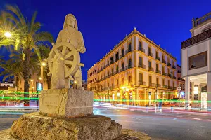 Light Trail Prints: View of Monument a la Gent de la Mar near harbour at dusk