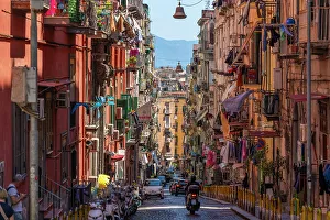 Sidewalk Prints: View of motocyclists and architecture on Via Francesco Girardi