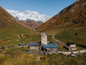 George Prints: View of Mount Shkhara with the iconic Church of St. George, Ushguli, Mestia