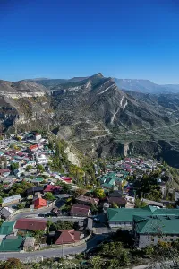 Settlement Prints: View of mountain village with surrounding peaks and clear blue sky in Dagestan, Russia