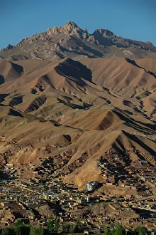 Settlement Prints: View over mountains in Bamyian from Shahr-e-Gholghola in Afghanistan near the City of Screams with clear skies