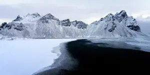 Azure Prints: View of the mountains of Vestrahorn from black volcanic sand beach after snowfall