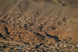 Settlement Prints: View over mountains and village in Bamyian with historical significance from Shahr-e-Gholghola in Afghanistan
