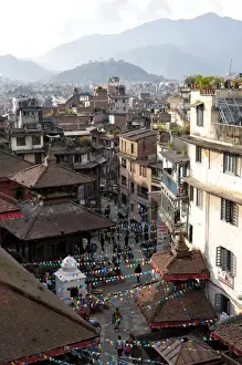 View over narrow streets and rooftops near Durbar Square towards the hilltop temple of Swayambhunath, Kathmandu