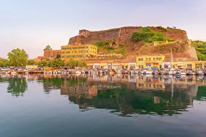 Waterfront Dining Prints: View of the New Fortress overlooking the Old Port Marina at sunset