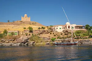 Nubia Prints: View of the Nile river and Aga Khan Mausoleum from small boat in Aswan