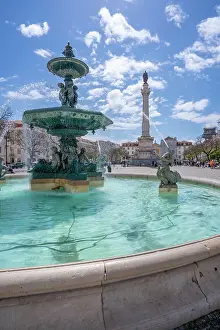 View of North fountain of Rossio in Praca do Rossio on a sunny day in Lisbon city centre, Lisbon, Portugal, Europe