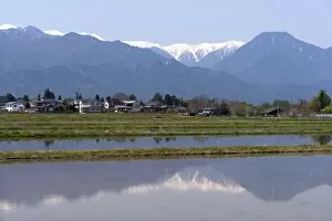 Images Dated 30th April 2009: View of the Northern Alps reflected in a flooded rice paddy, Nagano Prefecture, Japan