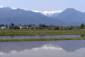 Images Dated 30th April 2009: View of the Northern Alps reflected in a flooded rice paddy, Nagano Prefecture, Japan
