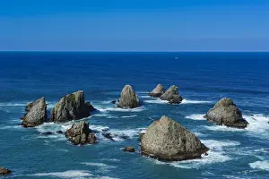 The Catlins Prints: View from the Nugget Point Lighthouse in the turquoise waters with huge rocks